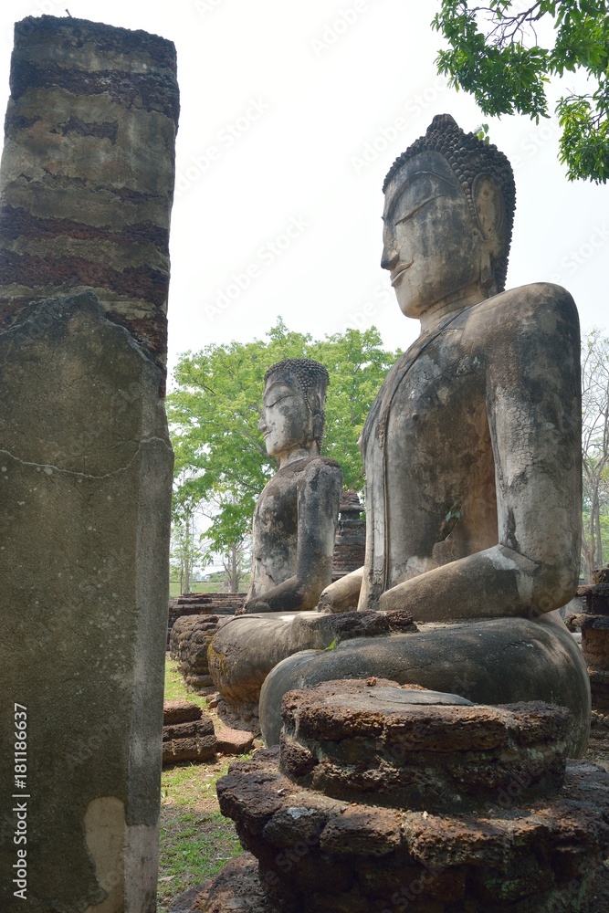 Buddha statue, ancient sculptures  of Buddha in ruins of Wat Phra Kaew. Kamphaeng Phet, Thailand