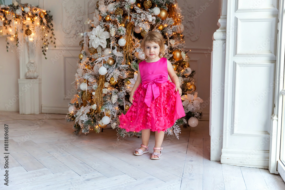 young girl near a Christmas tree