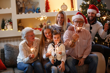 Family together for Christmaswith shiny sparkles