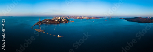 Aerial winter view of the Tokarevskiy lighthouse - one of the oldest lighthouses in the Far East, still an important navigational structure and popular attractions of Vladivostok city, Russia.