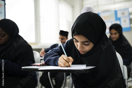 Muslim children studying in classroom photo