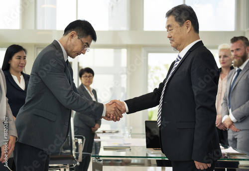 Business Partners Introductionary Handshake Bow photo