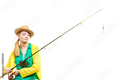 Woman with fishing rod , spinning equipment