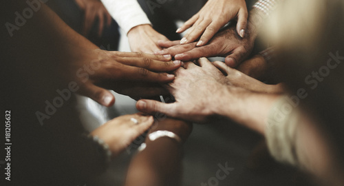 People with joined hands as a team photo