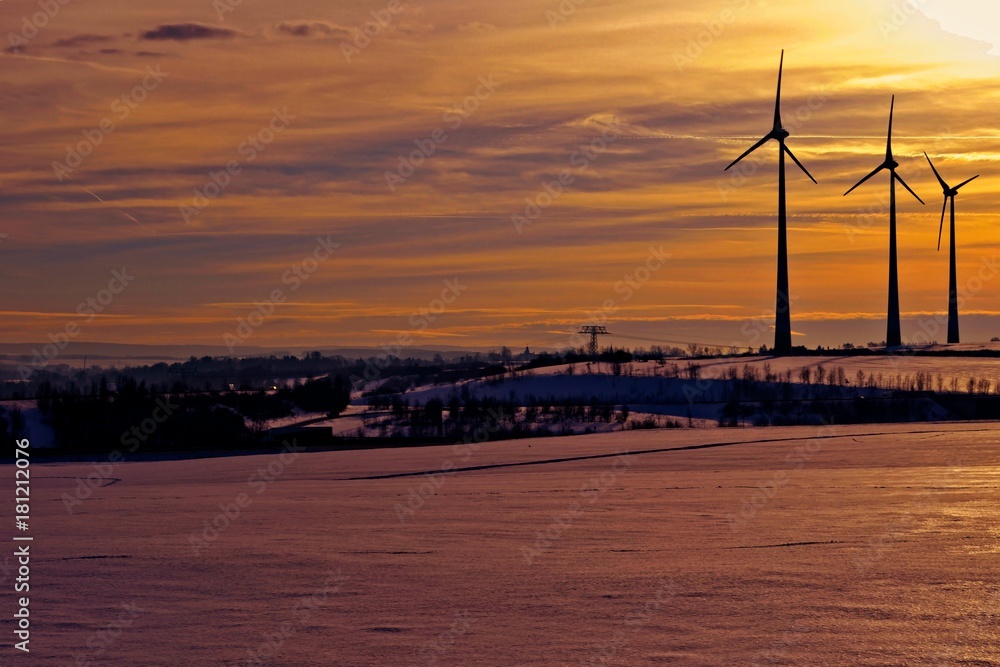 Wind turbines in the sunset on a winters day