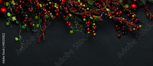 Christmas tree banches and red berries background photo