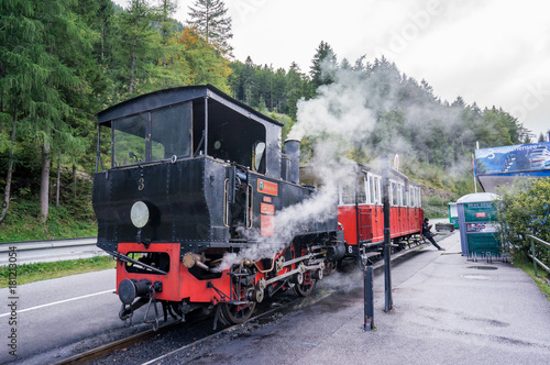  Old retro steam locomotive, black with red. Achensee, Jenbach, Austria.