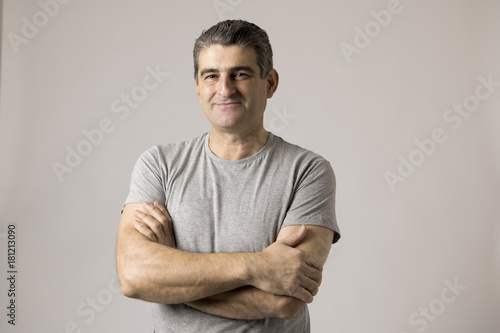 white man 40 to 50 years old smiling happy showing nice and positive face expression isolated on grey background