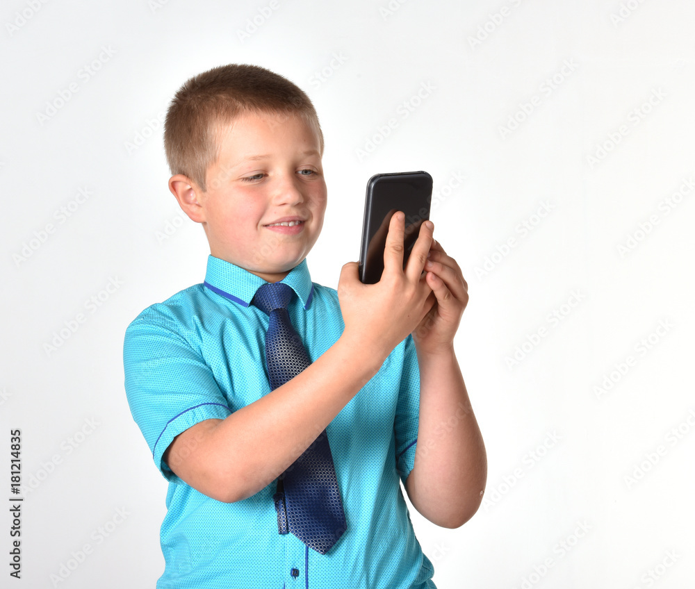 Isolated boy. A boy with a mobile phone. Business people. Isolated boy. A boy with a mobile phone. Business people.