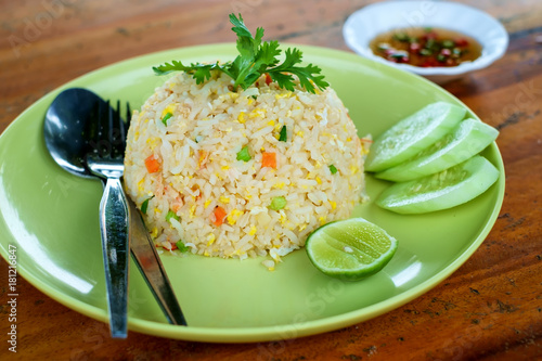 Fried rice with egg on wood...