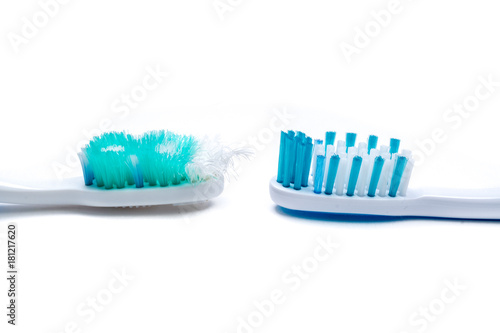 Image of used old and new toothbrushes isolated on a white background