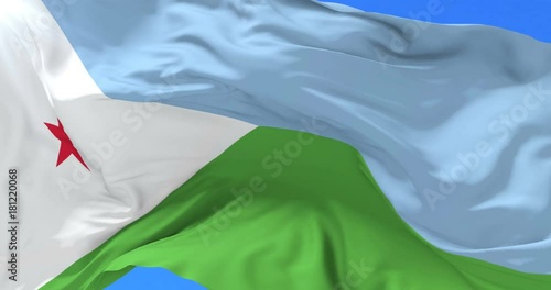 Flag of Djibouti waving at wind with blue sky in slow, loop photo