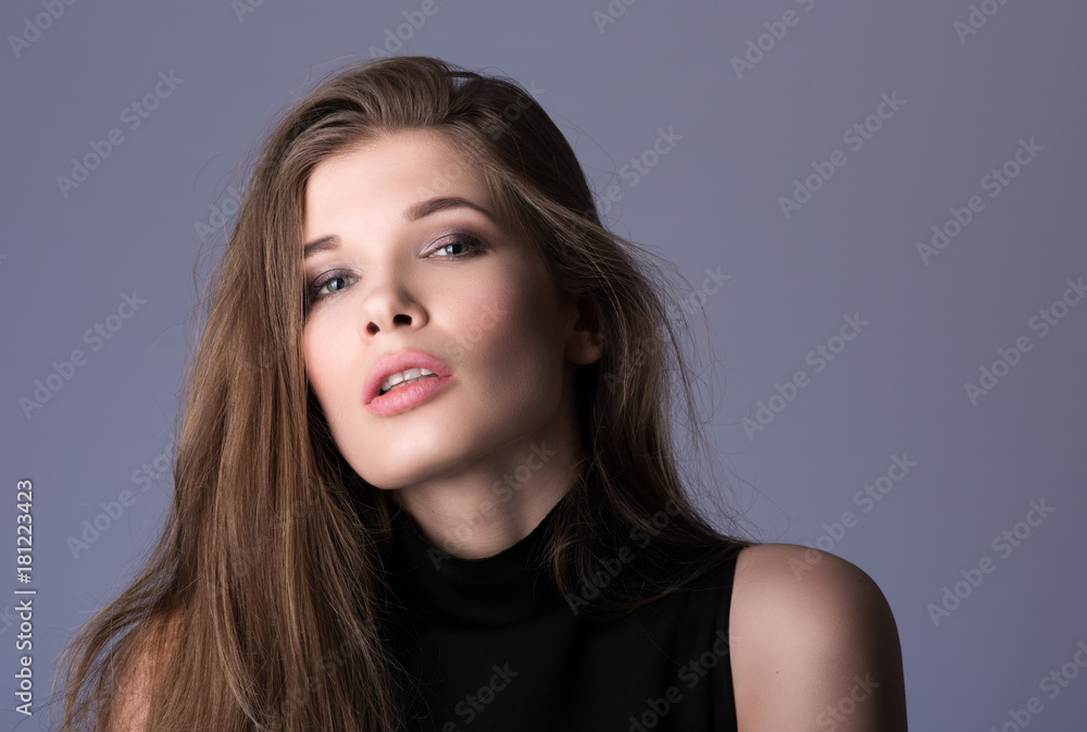 Portrait of beautiful young woman with long hair in black clothes Portrait of beautiful young woman with long hair in black clothes