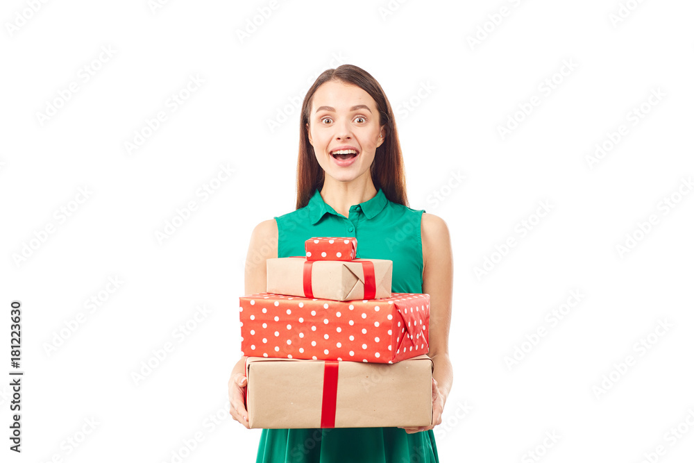 Portrait of young woman posing with heap of gift boxes on white background Portrait of young woman posing with heap of gift boxes on white background