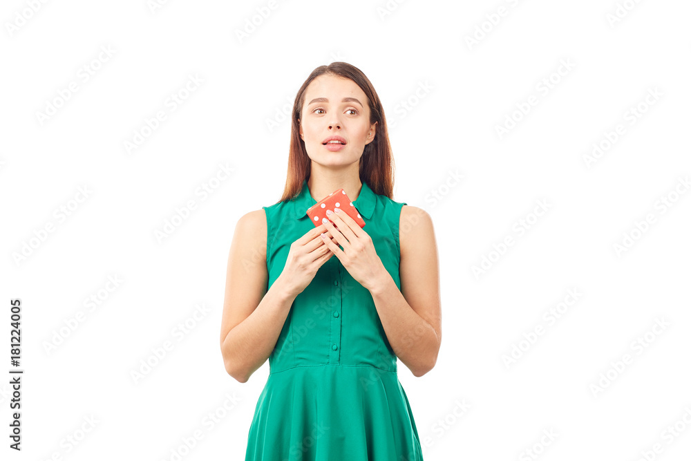 Studio portrait of beautiful young woman holding small gift box on white background Studio portrait of beautiful young woman holding small gift box on white background
