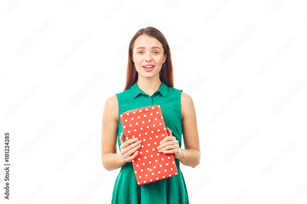 Portrait of young woman holding gift box wrapped in red paper Portrait of young woman holding gift box wrapped in red paper