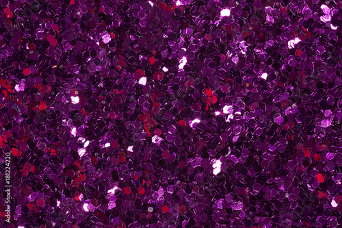 Dark violet confetti on shiny background. photo