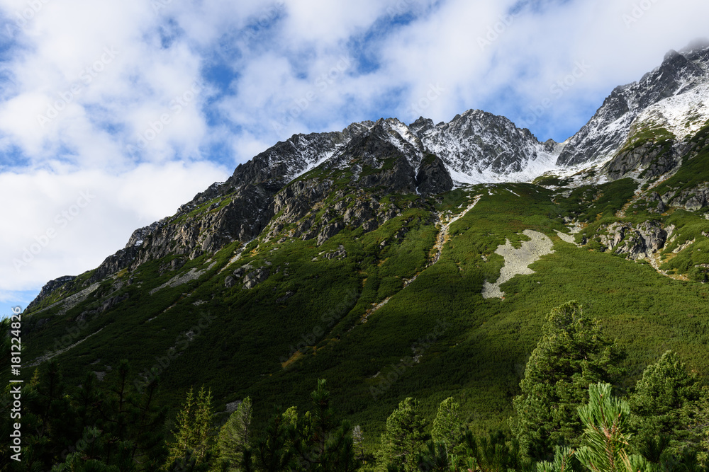 Obraz premium mountain tops in autumn covered in mist or clouds