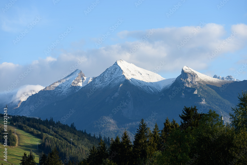 mountain tops in autumn covered in mist or clouds mountain tops in autumn covered in mist or clouds