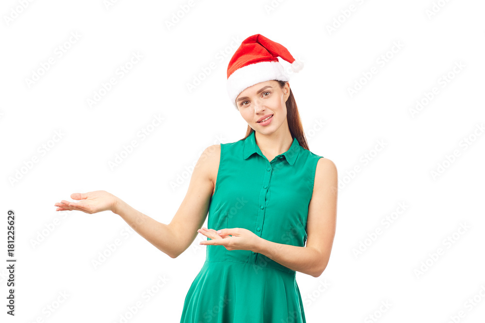 Young woman wearing emerald green dress and Santa hat on white background Young woman wearing emerald green dress and Santa hat on white background