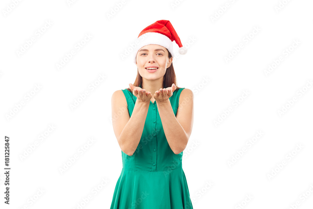 Young woman wearing emerald green dress and Santa hat on white background Young woman wearing emerald green dress and Santa hat on white background