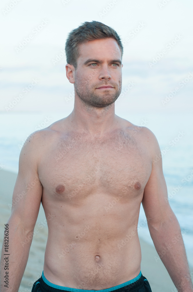 Portrait of topless man at beach Portrait of topless man at beach