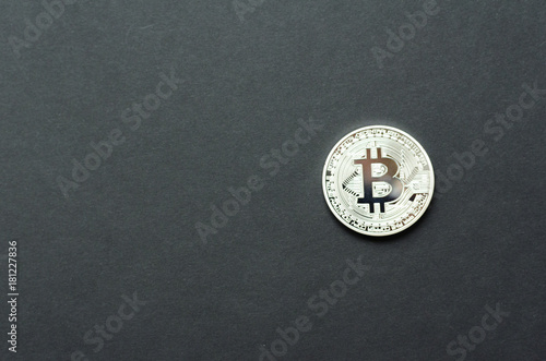 Silver bitcoin on grey background