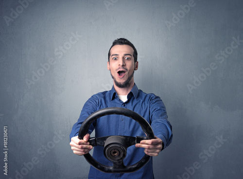Man holding steering wheel