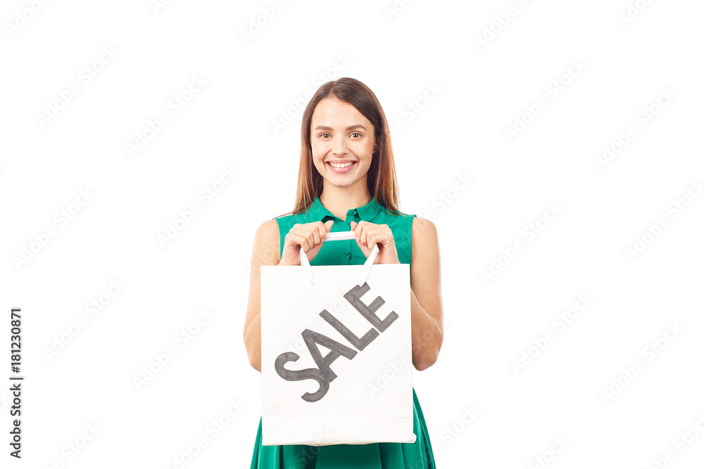 Portrait of female shopaholic holding shopping bags with sale/discount sign Portrait of female shopaholic holding shopping bags with sale/discount sign