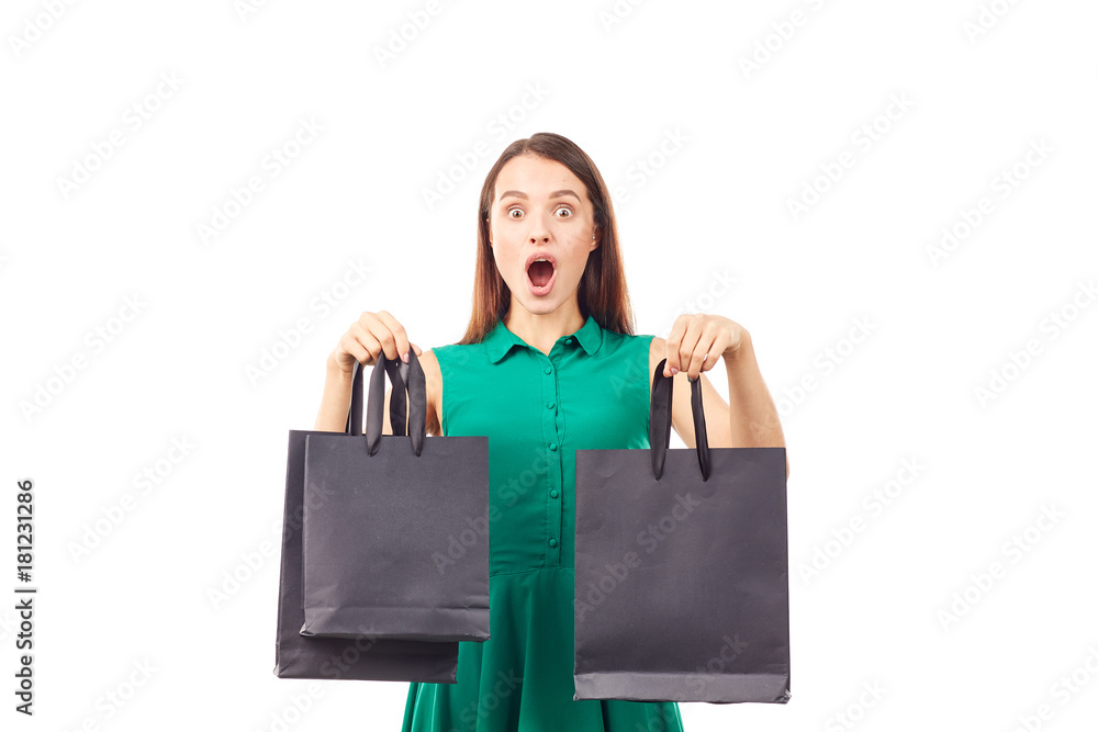 Portrait of female shopaholic holding black shopping bags Portrait of female shopaholic holding black shopping bags