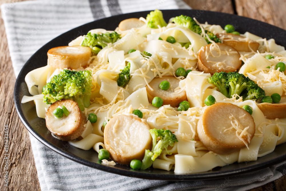 Fettuccine pasta with fried mushrooms, cheese and vegetables close-up. horizontal Fettuccine pasta with fried mushrooms, cheese and vegetables close-up. horizontal