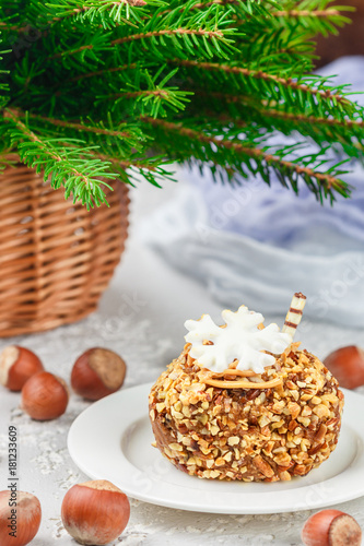 Cake with hazelnuts  caramel and white chocolate. .Christmas. New year. A festive treat for tea and coffee. Selective focus
