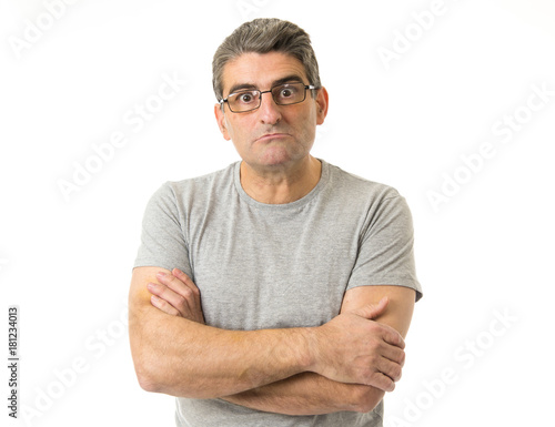 portrait of 40s weird and nerd man on glasses in ridiculous silly and stupid face expression looking at camera isolated on white