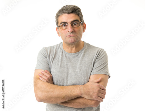 portrait of 40s weird and nerd man on glasses in ridiculous silly and stupid face expression  looking at camera isolated on white