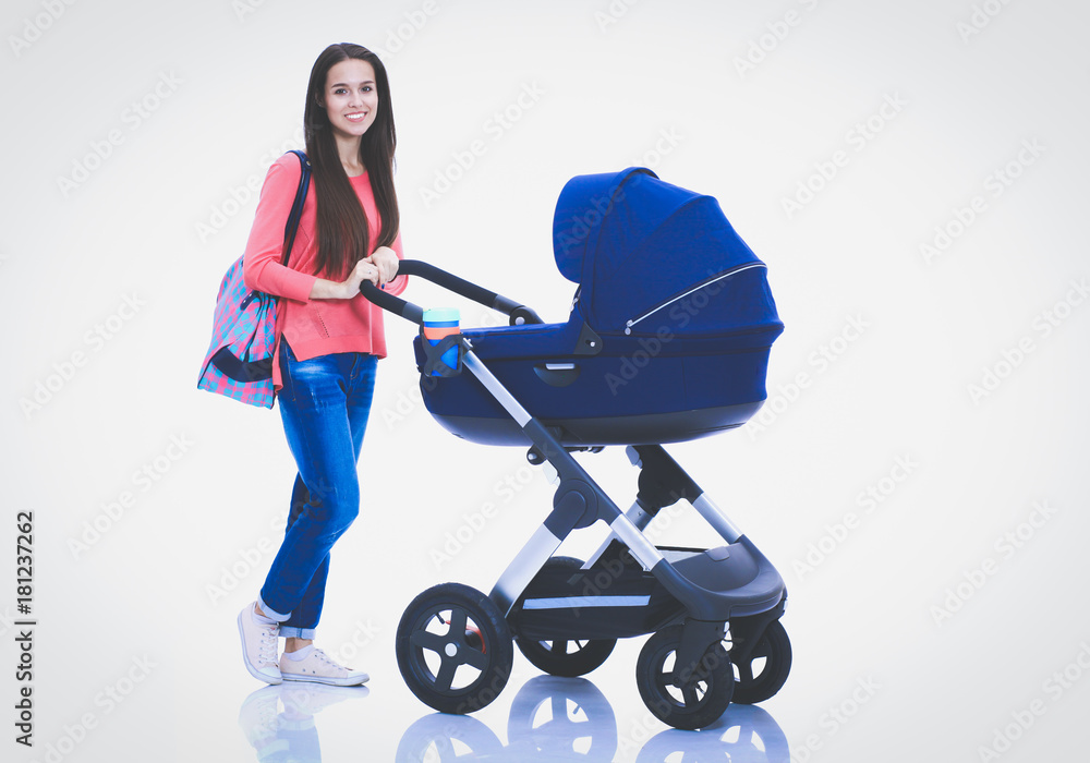 Full length portrait of a mother with a stroller, isolated on white background. Young mom Full length portrait of a mother with a stroller, isolated on white background. Young mom