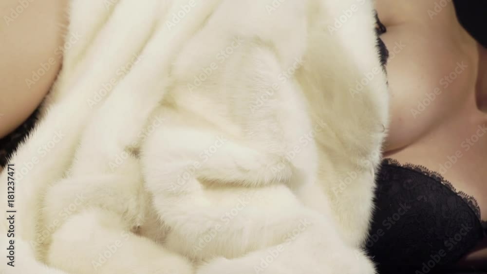 Beautiful woman in fur and lingerie. Close-up of lying sexy woman with perfect body in the fur coat. Winter mink coats for women. Beautiful woman in fur and lingerie. Close-up of lying sexy woman with perfect body in the fur coat. Winter mink coats for women.