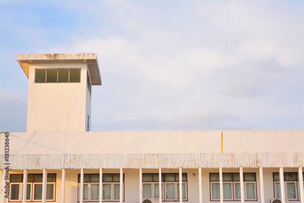 White building with before sunset background.