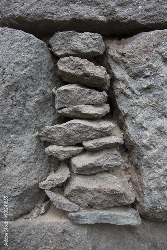Staple of small flat stone in a stone wall