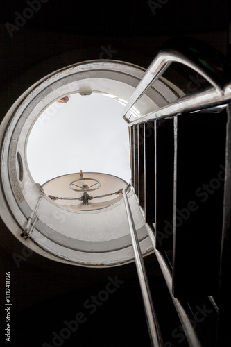 View up the exit ladder of a submarine, hatch open