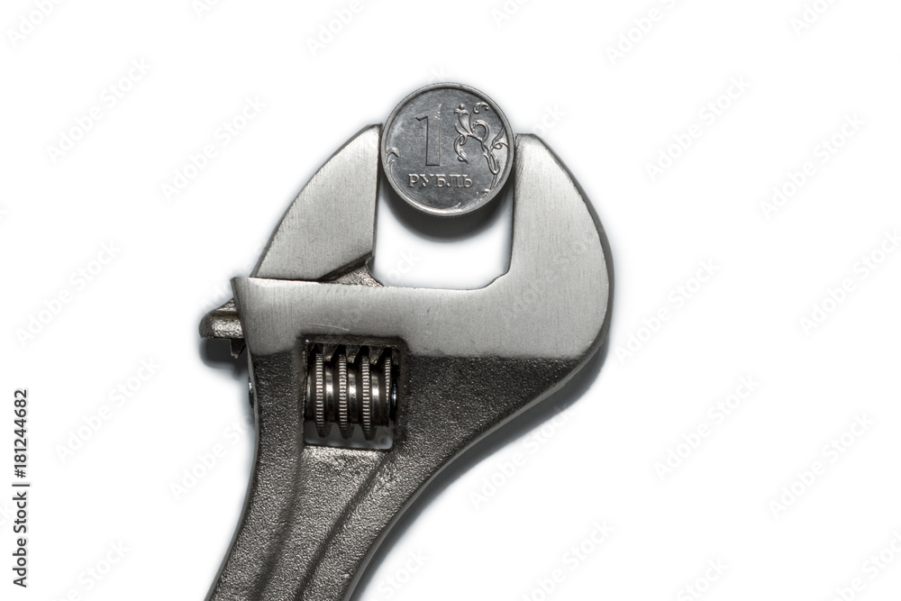 The coin in vise on the white background as a symbol of economic sanctions against of Russia The coin in vise on the white background as a symbol of economic sanctions against of Russia