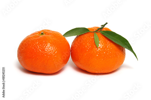 Tangerine or clementine with green leaf