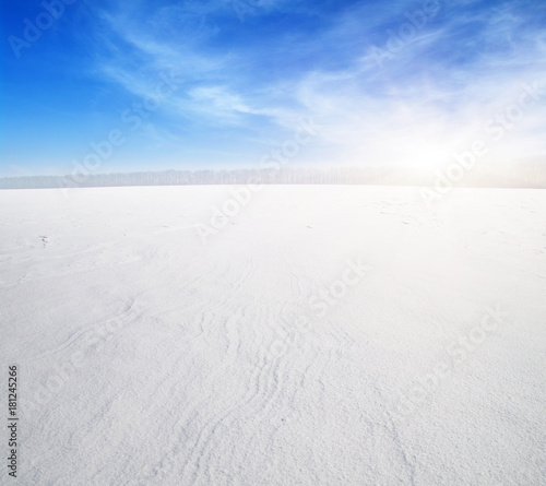  Snowcovered fields on blue sky