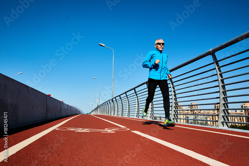 Senior man in activewear practicing jogging in the morning © pressmaster