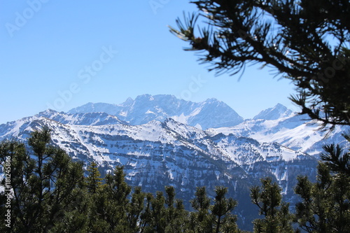 Landscape of snowy Alp mountains with forests, taken from Alpspitz peak in Gaflei village in the municipality of Triesenberg in Principality of Liechtenstein. photo