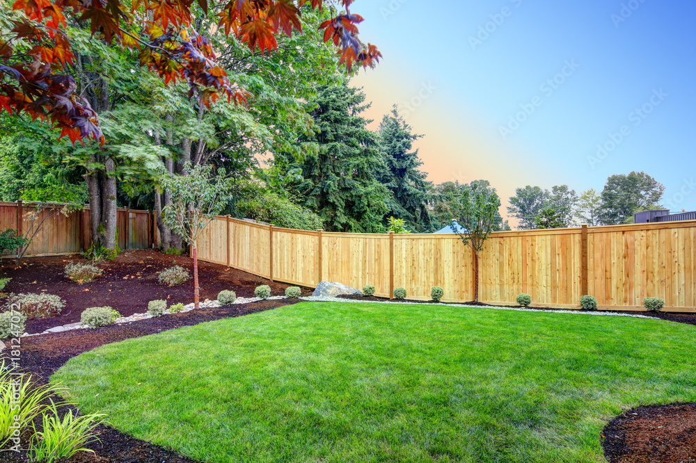 Nice fenced backyard with new planting beds - obrazy, fototapety, plakaty 