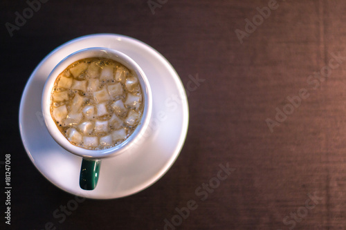 Coffee in cafe with marshmallow with blurred background. photo