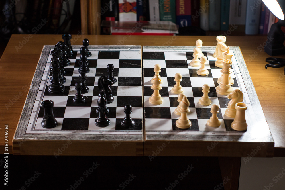 chess board from the side with multiple moves made chess board from the side with multiple moves made