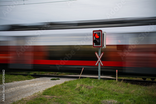 A train passing at a high speed around the road, Austria, Europe