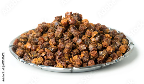 Propolis granules inside plate, bee product