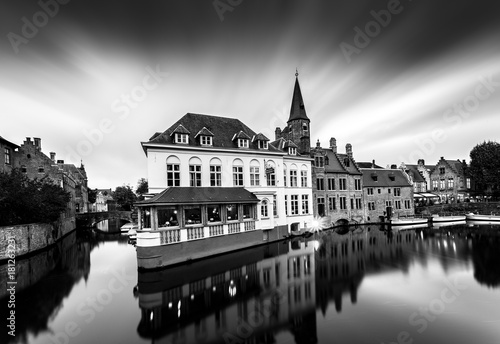 Bruges is a beautiful and characteristic town in Flanders (Belgium). The view in a gloomy atmosphere due to the bad weather keeps its charm and character in its historical architecture.